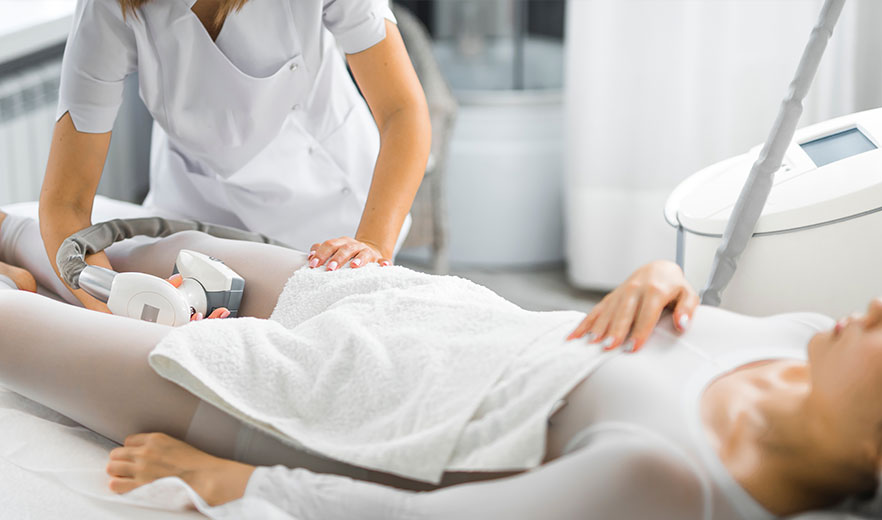 Woman lying on the bed during LPG Endermologie Body Massage session